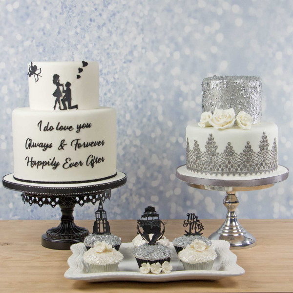 Image of multiple cakes decorated with cake lace.
