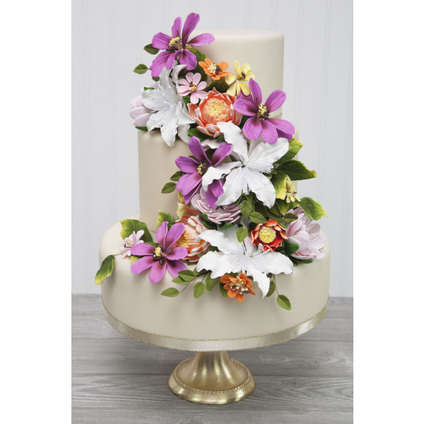 Image of flower on a cake with other flowers.