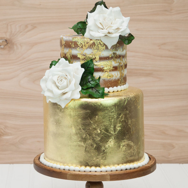 Image of gold leaf cake with pearl trim.