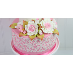 image of flowers on cake and lace