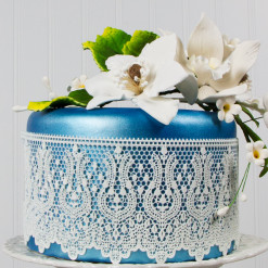 Image of cake decorated with cake lace.