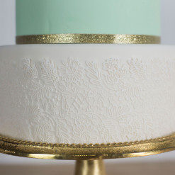 Detail image of lace piece on a cake.